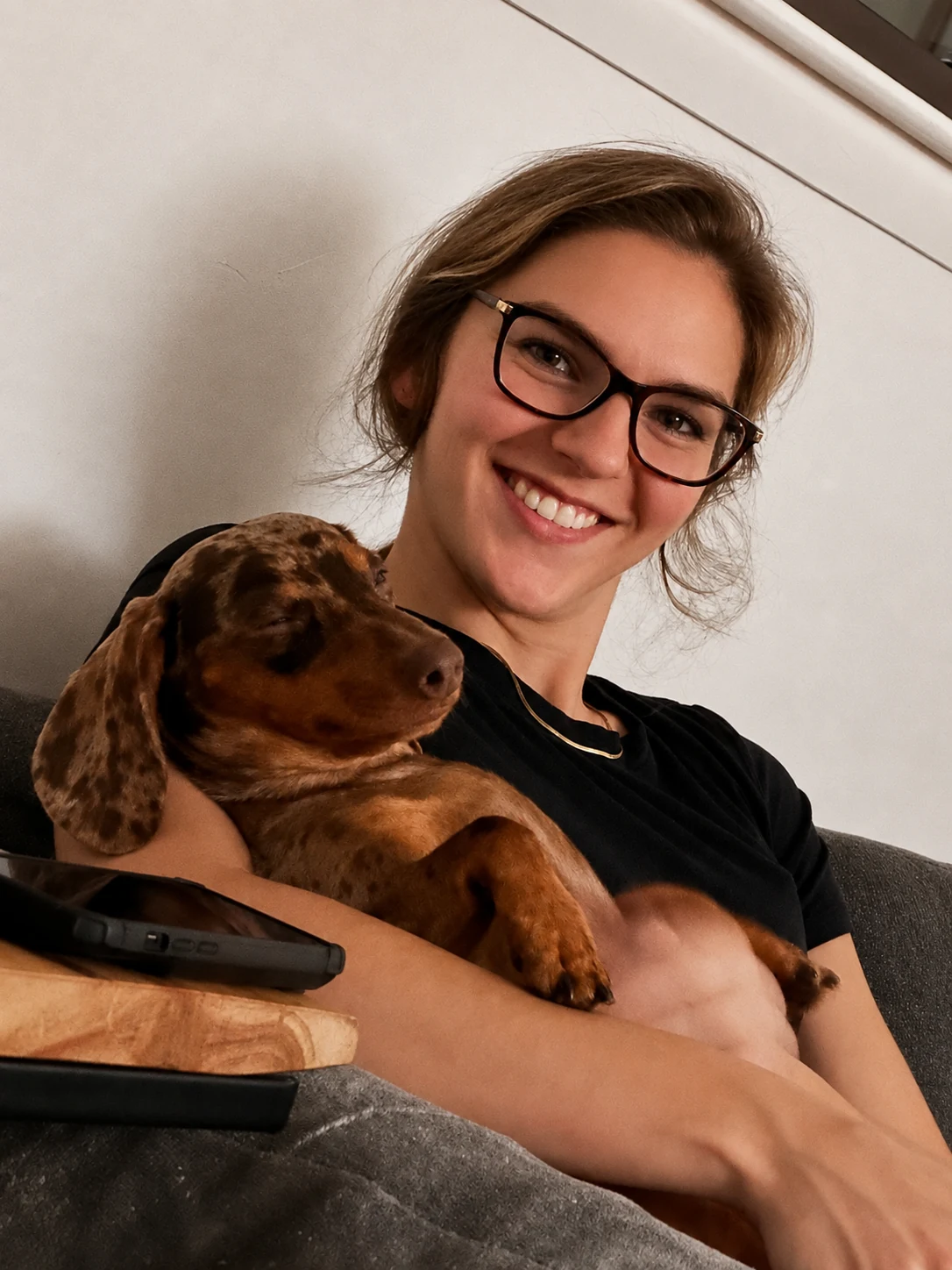 Crystal Courtright holding a dachshund puppy